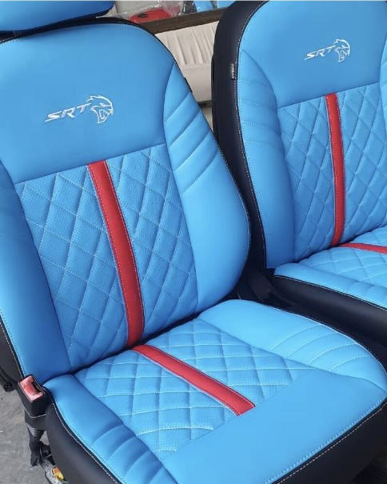 Dodge Charger seats in sky blue leather with diamond quilting, red centre stripe and embroidered SRT logo